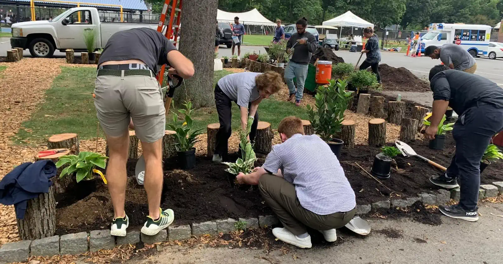 People working on a flower garden