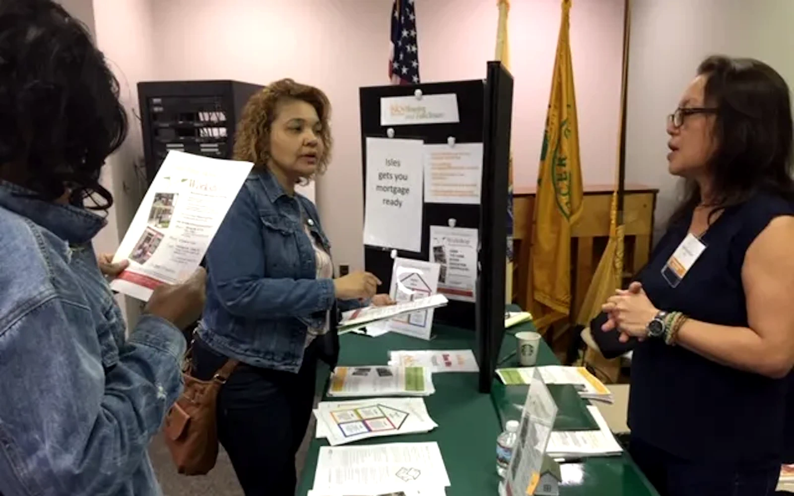 Isles financial services table with people interested in available financial opportunities