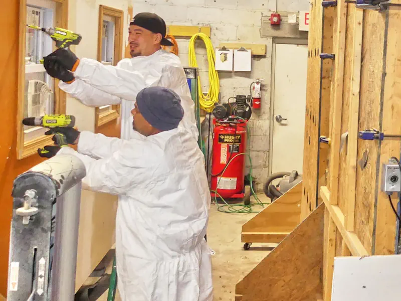Two environmental workers working on a construction project